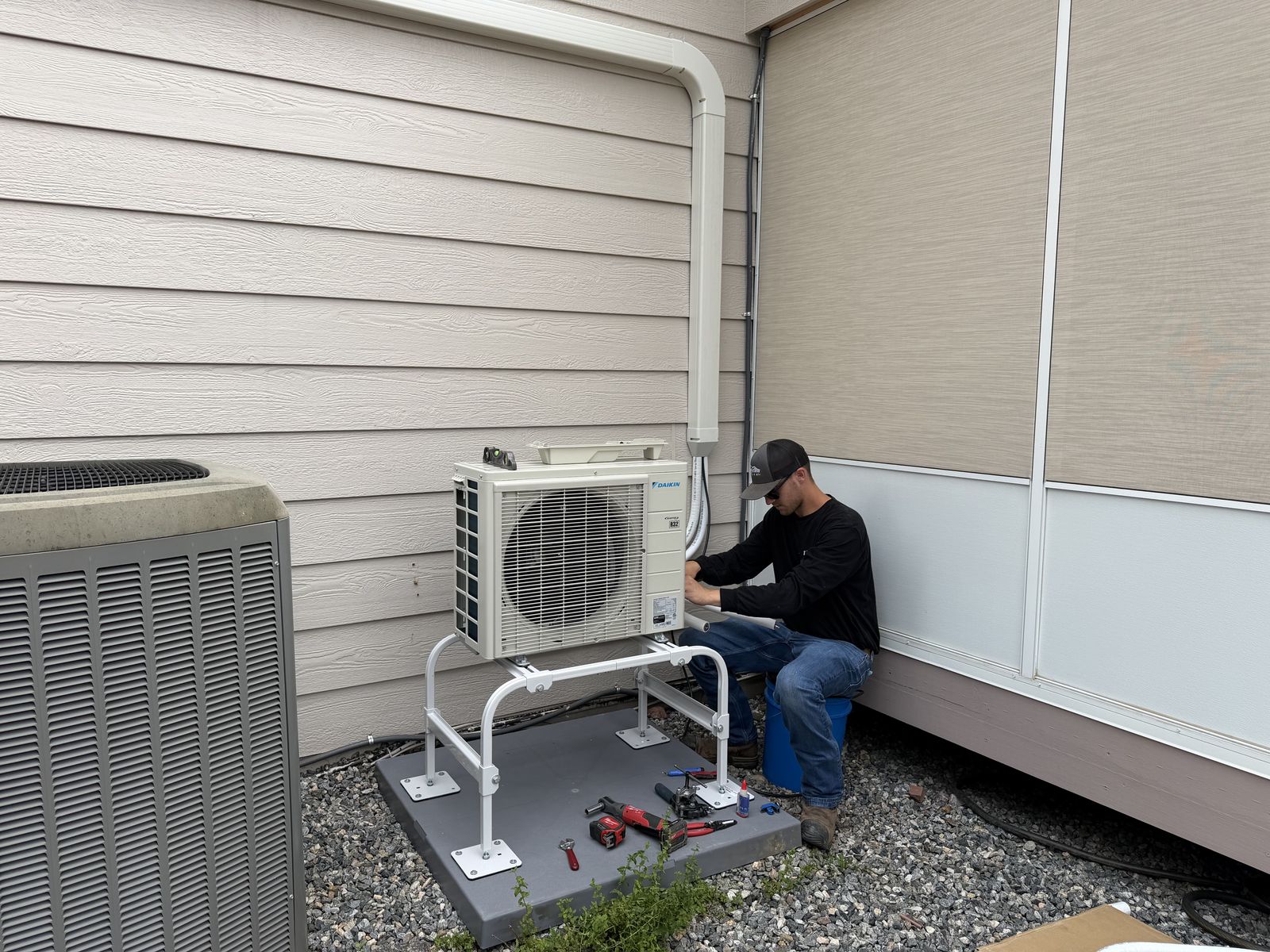 Longview Heating & Air technician installing a Daikin ductless mini-split outdoor unit on the northern Front Range