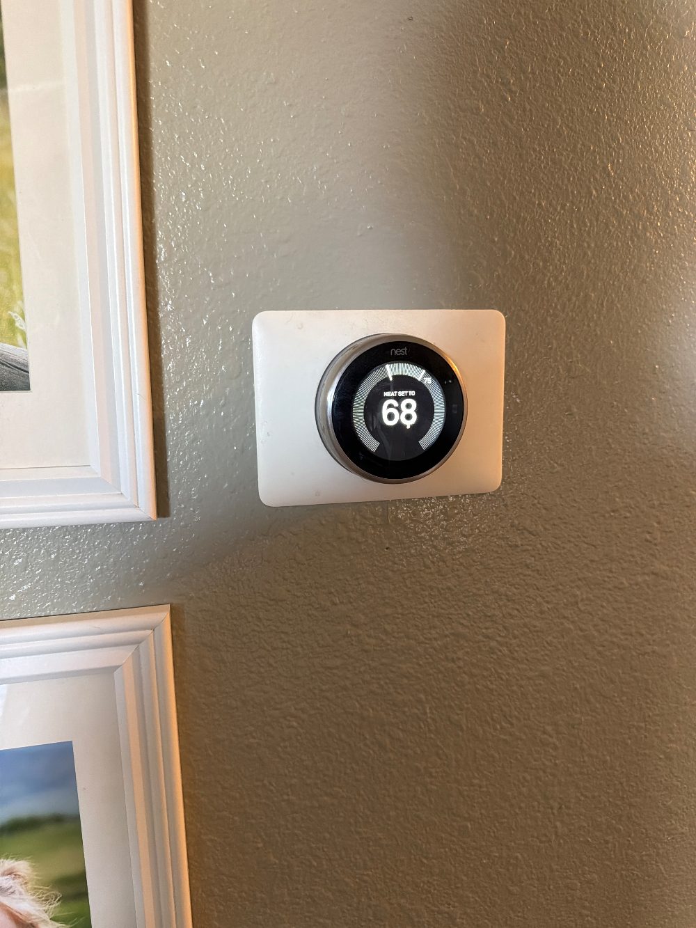 A wall thermostat set to heat at 68 degrees, the standard winter efficiency baseline